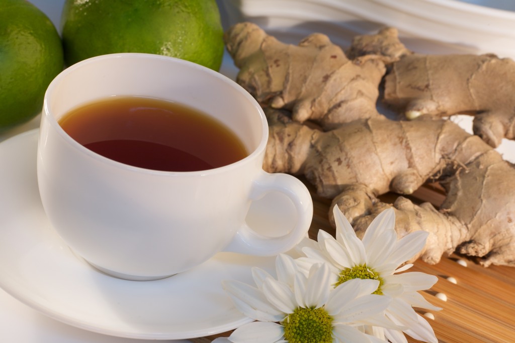 A cup of ginger tea with ingredients